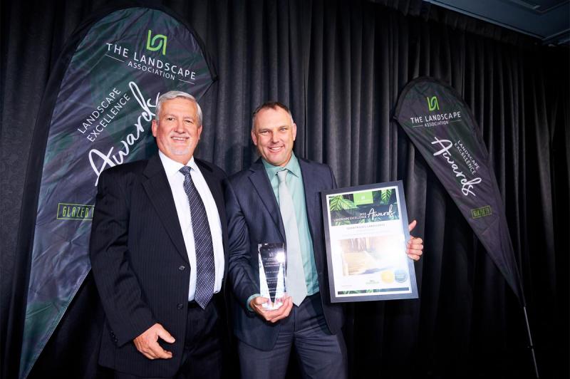 Glenn Simpson accepting the Gold Award and Best In Category Award for Commercial and Civil Construction Up to $250,000: Kings Lane Reserve 